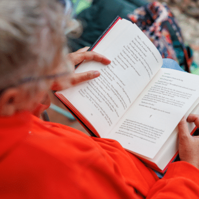 Person holding an open book