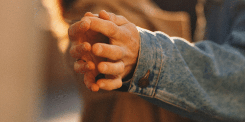 couple with their hands touching Photo by Natalia Sobolivska on Unsplash